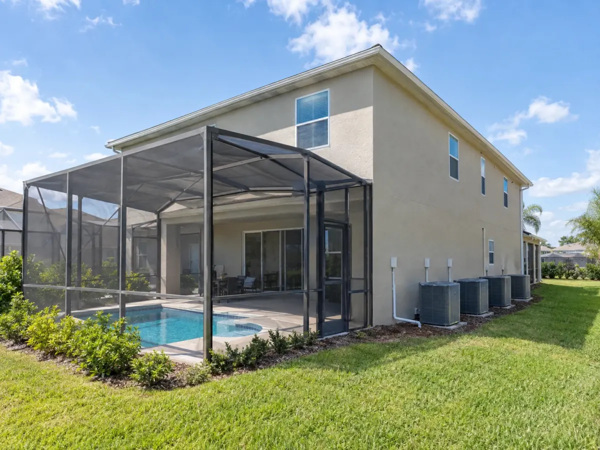 Mold remediation in Davenport, FL · illustrative image of vacation home with a pool cage and AC units with condensate lines